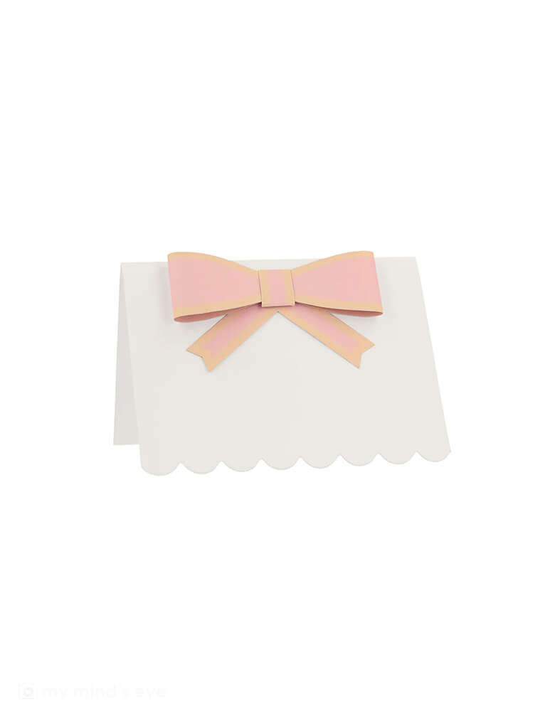 A close up of Momo Party's 3.5"x 2.5" Pastel Bow Place Card by Meri Meri. Featuring pretty pastel colors in 8 different colors, including pale pink, pink, dark pink, ivory, yellow, peach, mint and blue, each of the place card has a 3D paper bow on them, making this an elegant yet darling addition to your tableset.