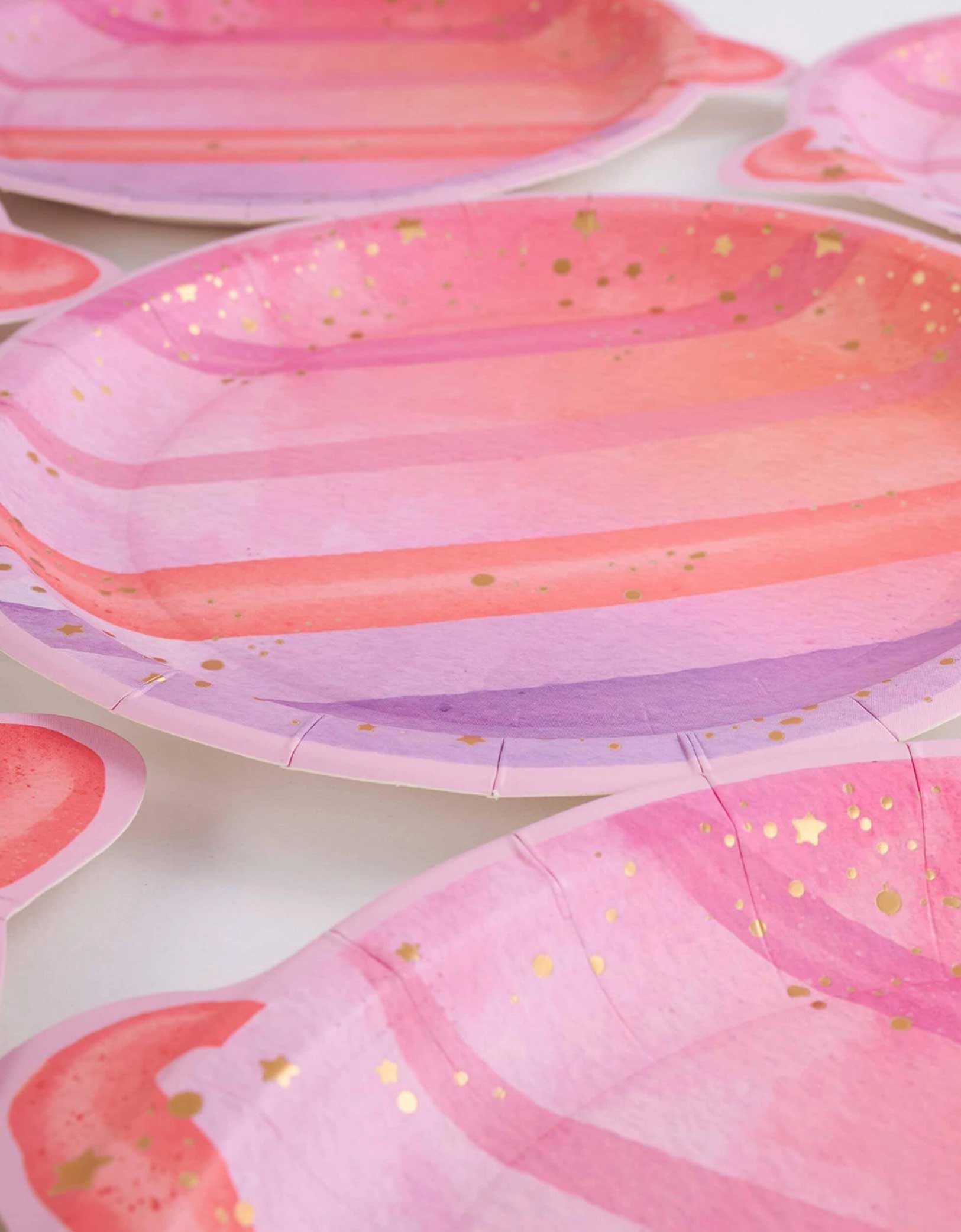 A set of Momo Party's 8" Pink Planet shaped Plates with gold speckles on a white background.