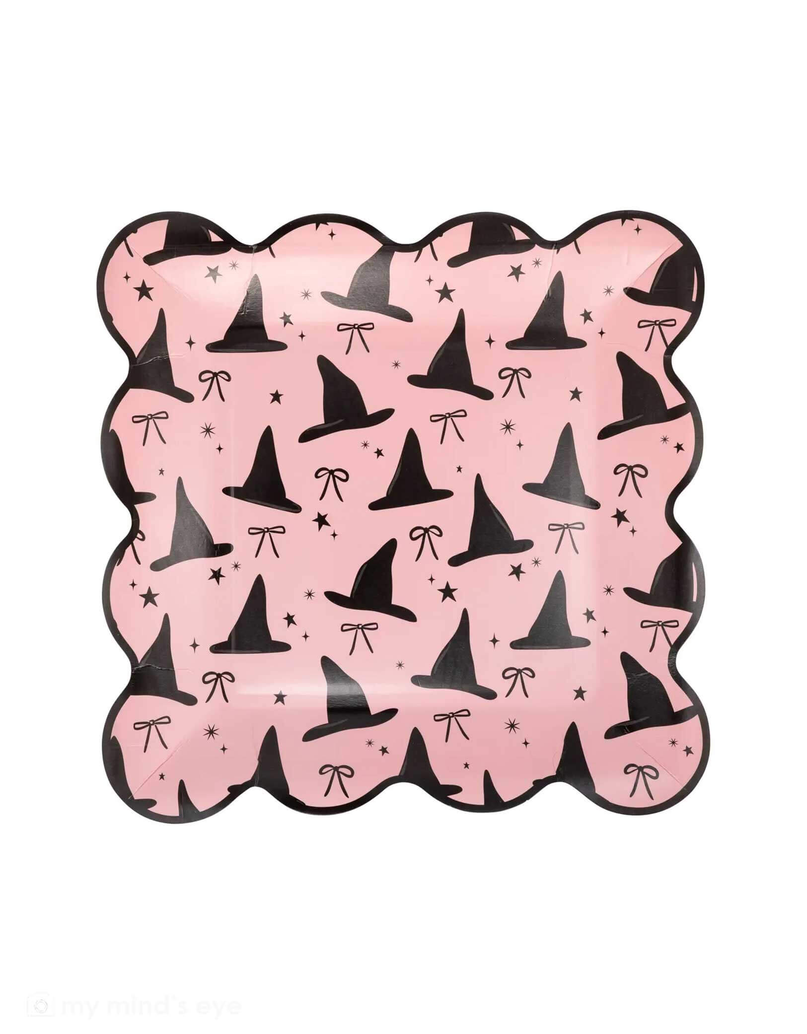 Momo Party's 9" Pink Witch Hats Scallop Plate with black witch hats and bows pattern by My Mind's Eye on a white background.
