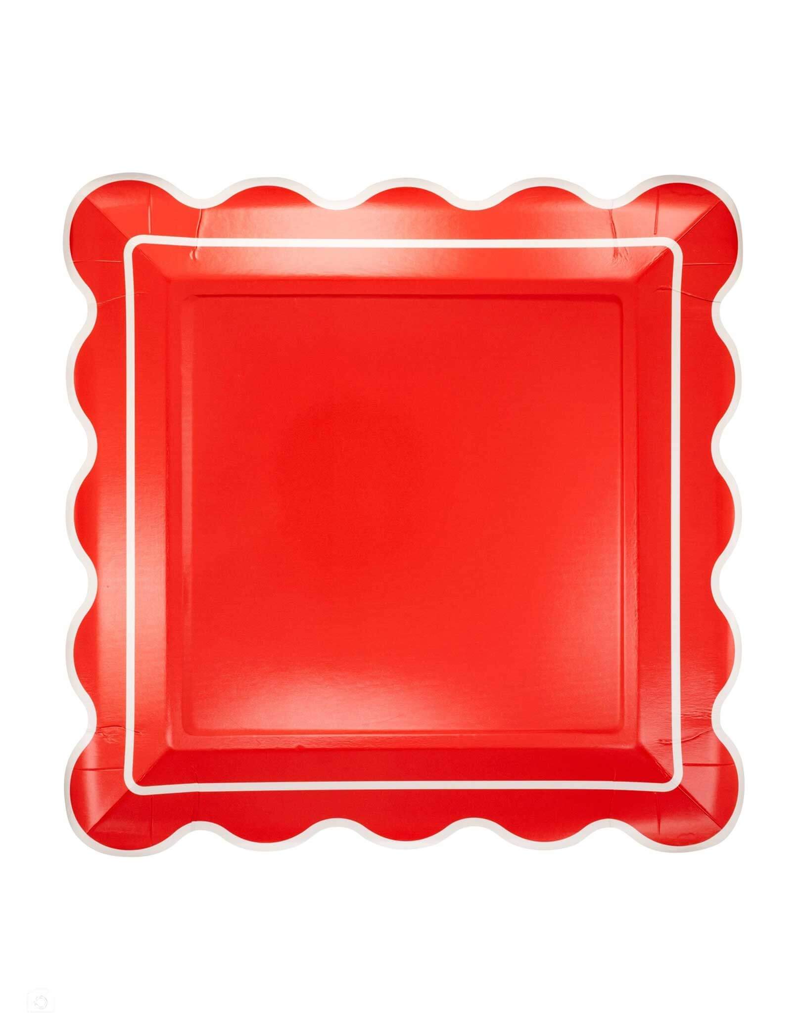 Momo Party's 10" red scalloped-edge square plate by My Mind's Eye on a white background. Elevate your holiday gatherings with this Red Scalloped Square Plate, designed to add a festive touch to any celebration. Its vibrant red color and elegant scalloped edges make it perfect for serving Christmas treats, coordinating effortlessly with your party décor.
