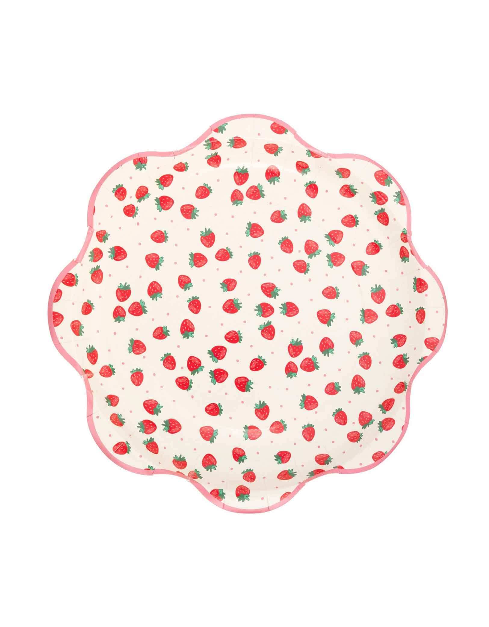 Momo Party's 10" Scattered Strawberries Party Plates by My Mind's Eye on a white background. Featuring a lively scatter of strawberries, this plate is perfect for serving treats and snacks with a festive flair. Durable and eye-catching, it’s an effortless way to brighten up any celebration.
