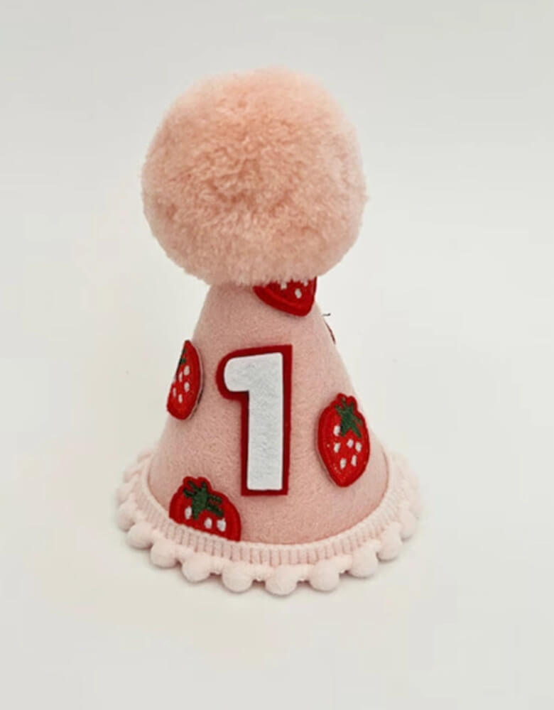 Strawberry shortcake felt first birthday hat for girls from momoparty.com. Adorned with sweet strawberries and playful pom poms, this pink felt hat adds the perfect touch of cuteness to any party outfit. A must-have for any girl's special day.