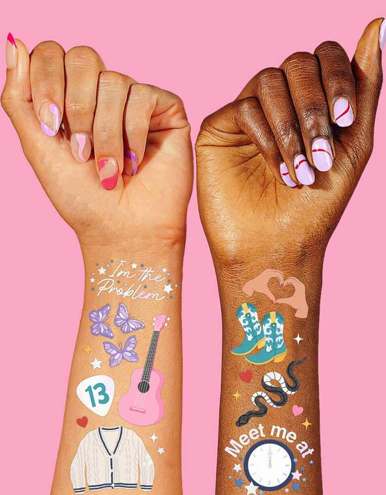 Momo Party's Taylor Swift Eras Tour Temporary Tattoos by Xo, fetti on models' arms. Featuring Taylor Swift inspired designs including 13, cowgirl boots, pink guitars, red lip stick, butterflies and disco ball, thees temporary tattoos are prefect for Swifties Taylor Swift themed party!