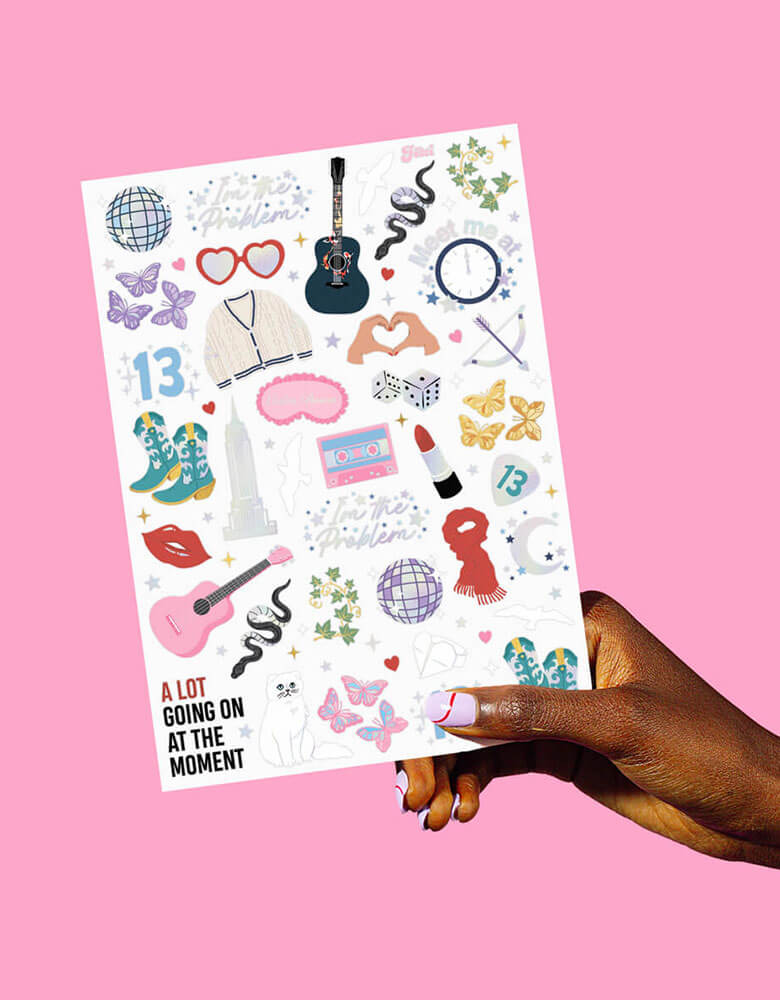Momo Party's Taylor Swift Eras Tour Temporary Tattoos by Xo, fetti. Featuring Taylor Swift inspired designs including 13, cowgirl boots, pink guitars, red lip stick, butterflies and disco ball, thees temporary tattoos are prefect for Swifties Taylor Swift themed party!