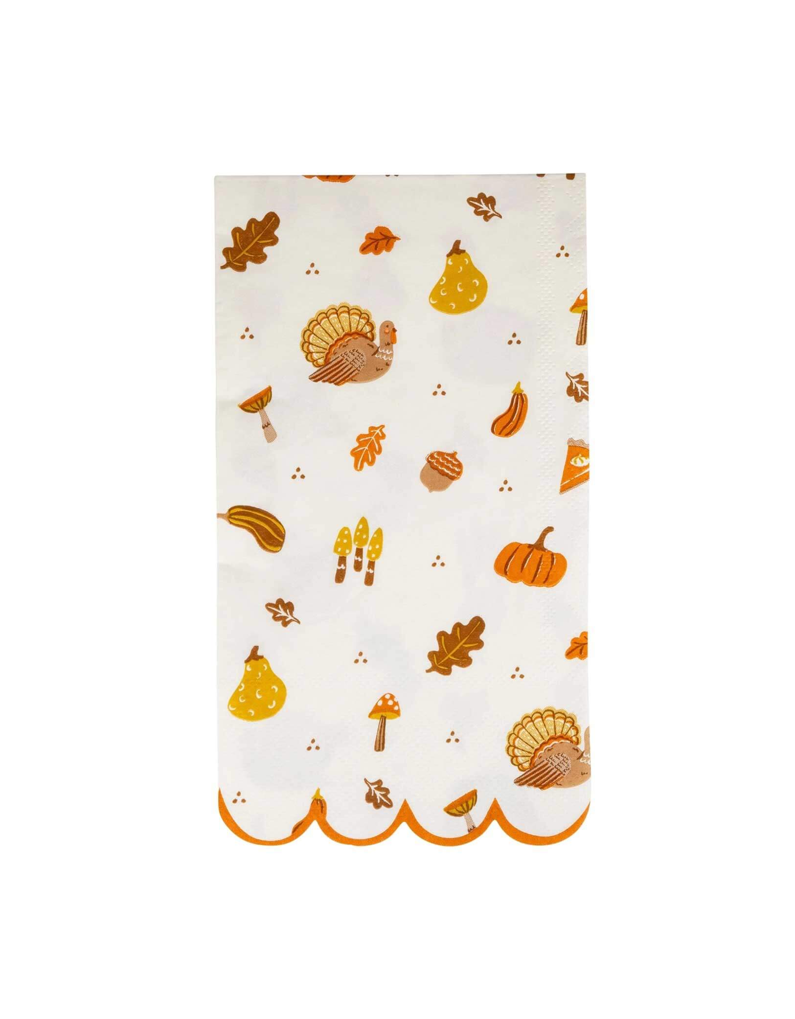 Momo Party's 4.25" x 7.75" Thanksgiving Icons dinner napkin with decorative Thanksgiving-themed illustrations including turkeys, pumpkins, pumpkin pies, acorns, fall leaves and more with orange scallop edge by My Mind's Eye on a white background.