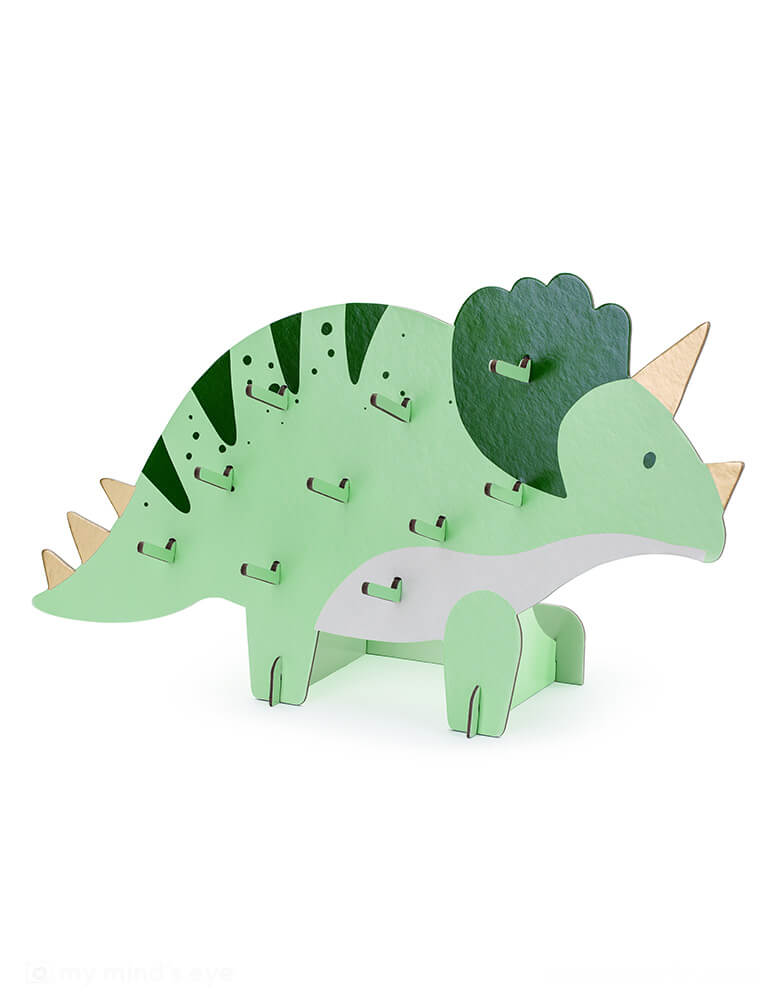 Momo Party's 15" x 9" Triceratops Snack Wall by Party Deco. Comes with 10 pegs to hold small snacks including donuts or pretzels, this Triceratops shaped snack wall is perfect to set the scene for an adorable kid's dinosaur themed party. 
