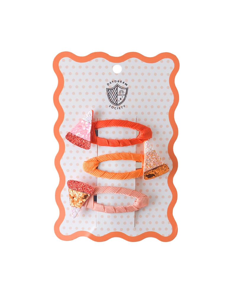 Momo Party's set of Halloween candy corn hair clips in pink and peach colors on a Daydream Society branded card with a white background.
