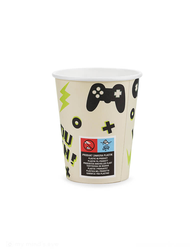 The back of Momo Party's 7.4 oz Video Game Party Cups by Party Deco with. Designed with a game device motif pattern with a pixelated word "PLAY" on it, this set of 6 party cups is perfect for any gamer. They add a playful touch to your kid's video game themed party or birthday celebration.