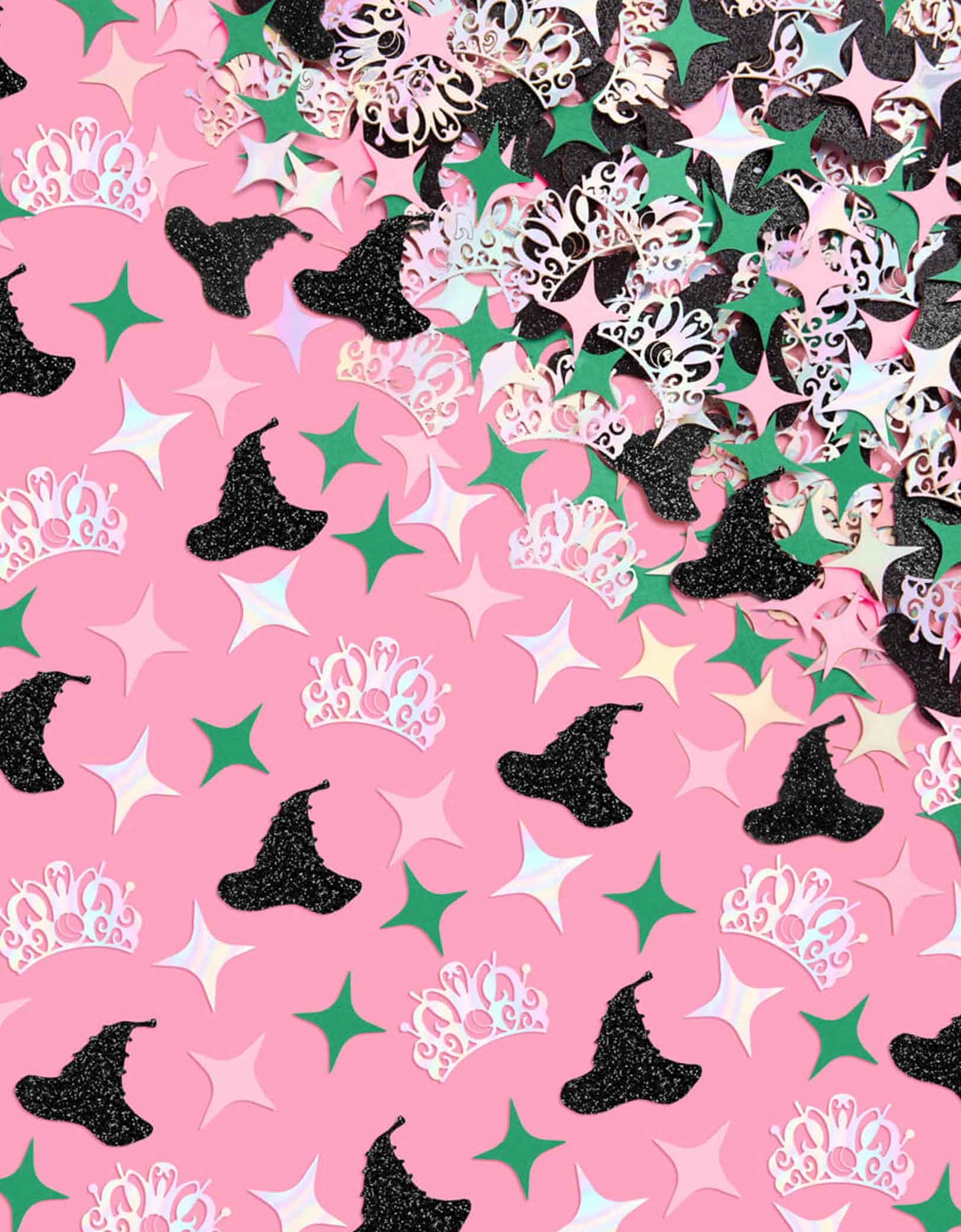 Momo Party's Wicked Witch Confetti featuring witch hats, tiaras, and stars on a pink background. This playful mix features tiny witch hats, sparkling tiaras, and bursts of pink and green confetti, perfect for casting a fun, wickedly charming spell over any party. Sprinkle it on tables or toss it in the air to enchant your guests with a festive, colorful vibe.
