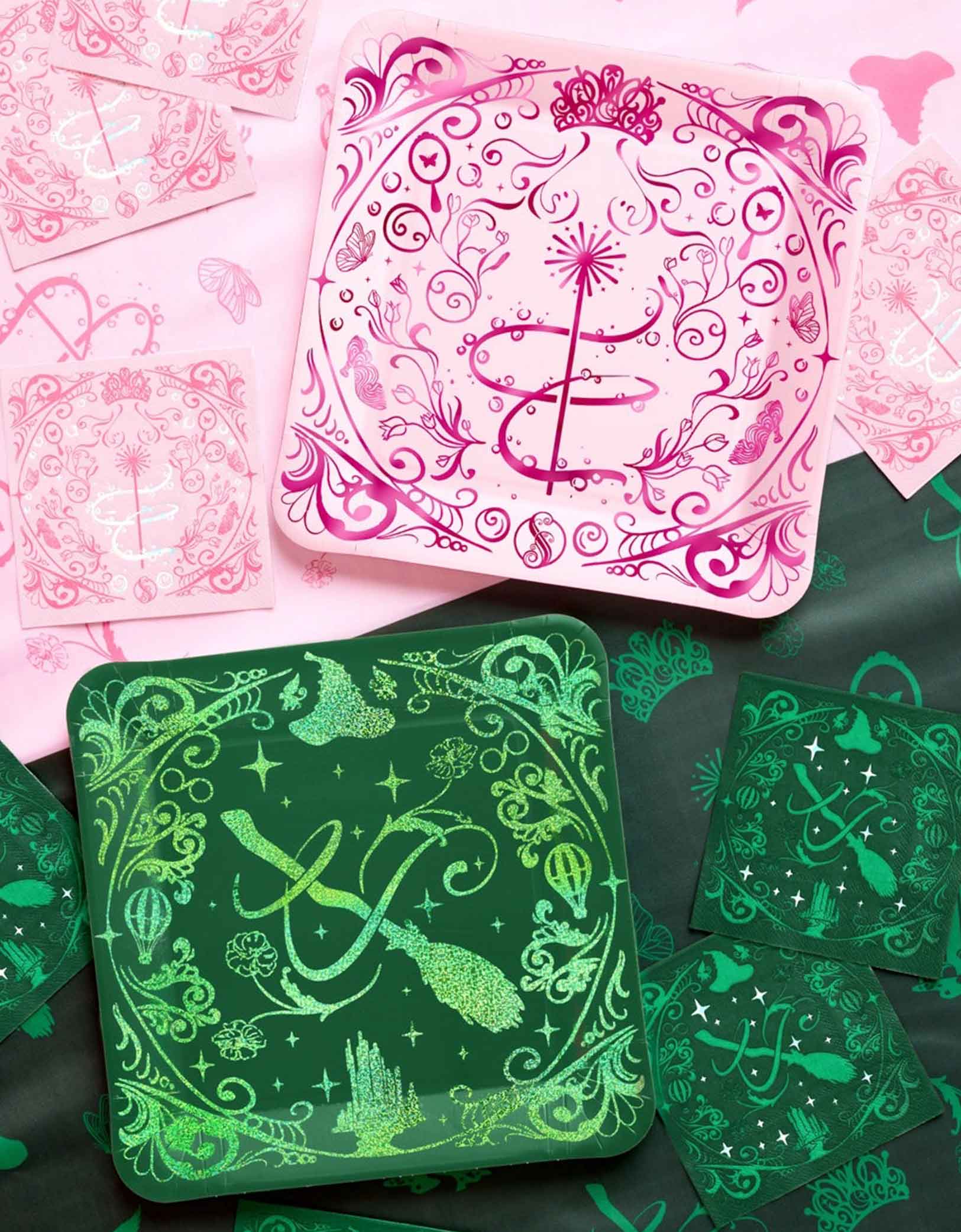 Momo Party's 10.5" Wicked Party dinner plates and napkins in pink and green designs on a two-tone tablecloth. 