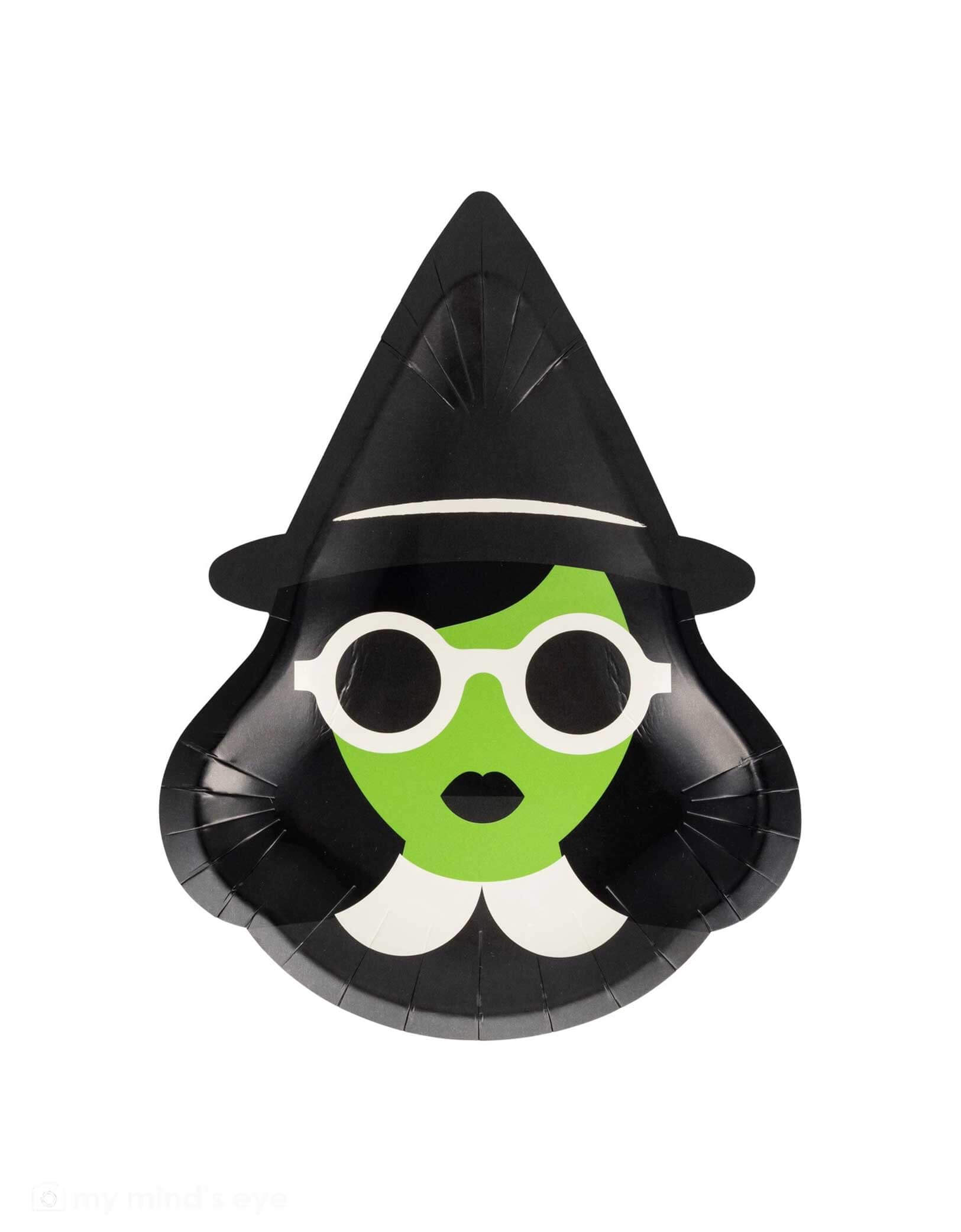 Momo Party's 7.5" x 10" Bad Witch Plates by My Mind's Eye. Comes with a set of 8 paper plates, perfect for serving spooky snacks or magical munchies at your Halloween party or Wicked themed birthday party, these witch shaped plates in green and black add a bewitching touch to your party table. The playful "Good Witch" design brings fun Halloween vibes without the fright factor. Grab these for your next spellbinding soirée!