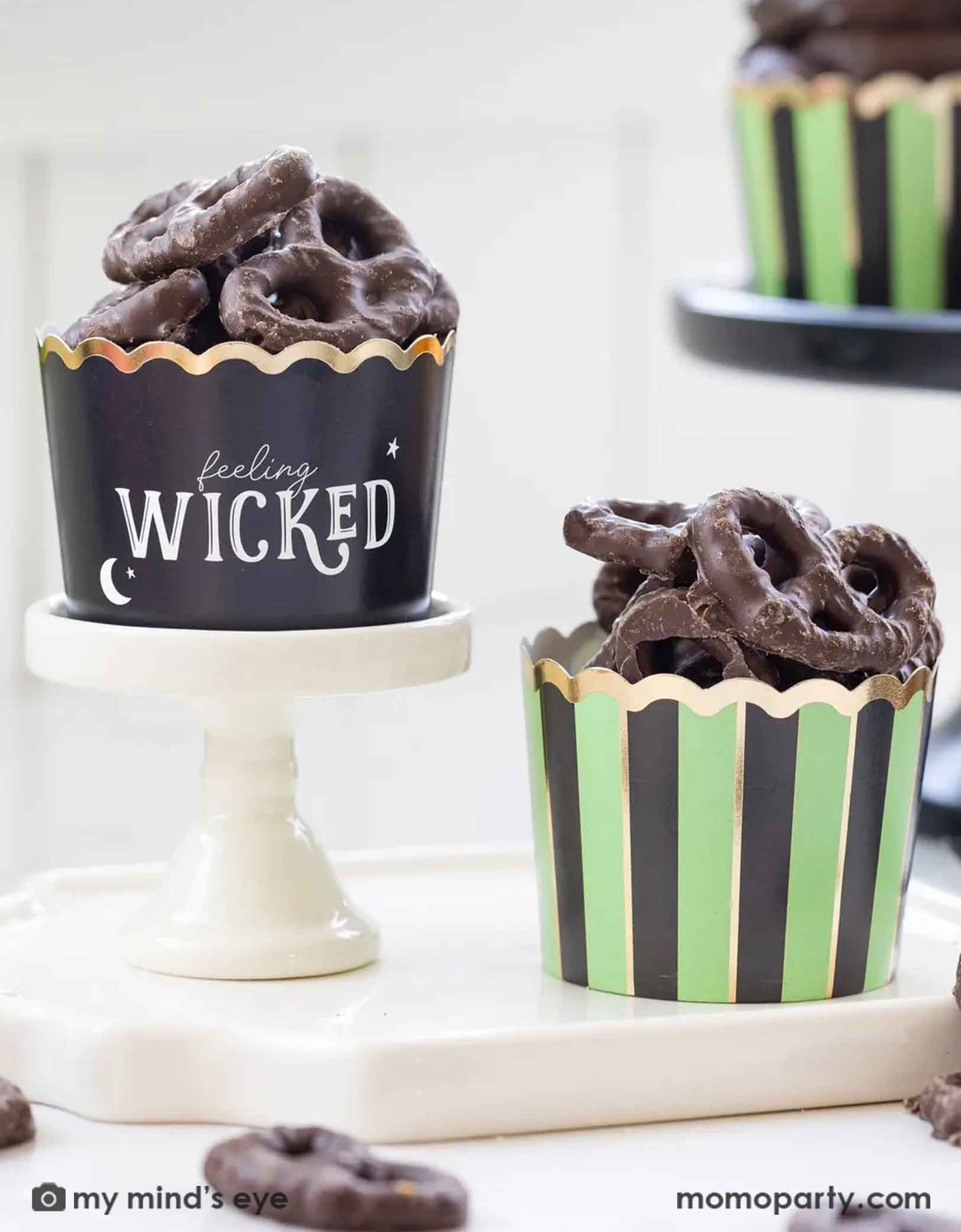 Chocolate pretzel treats in Momo Party's black and green striped cupcake baking cup with 'feeling WICKED' text.