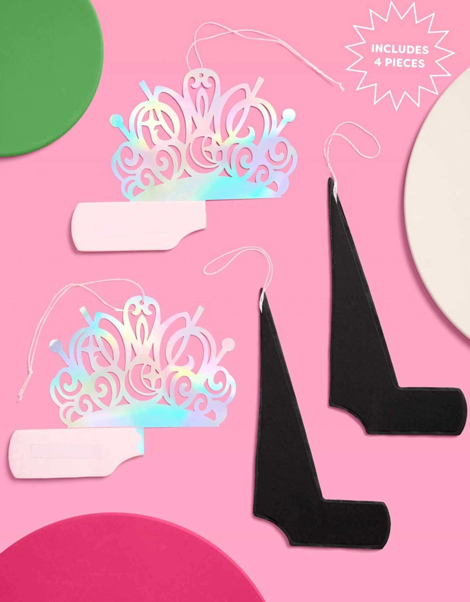 Momo Party's Wicked Holographic tiaras and black witch hat honeycombs on a pink background with text indicating 'Includes 4 Pieces'.