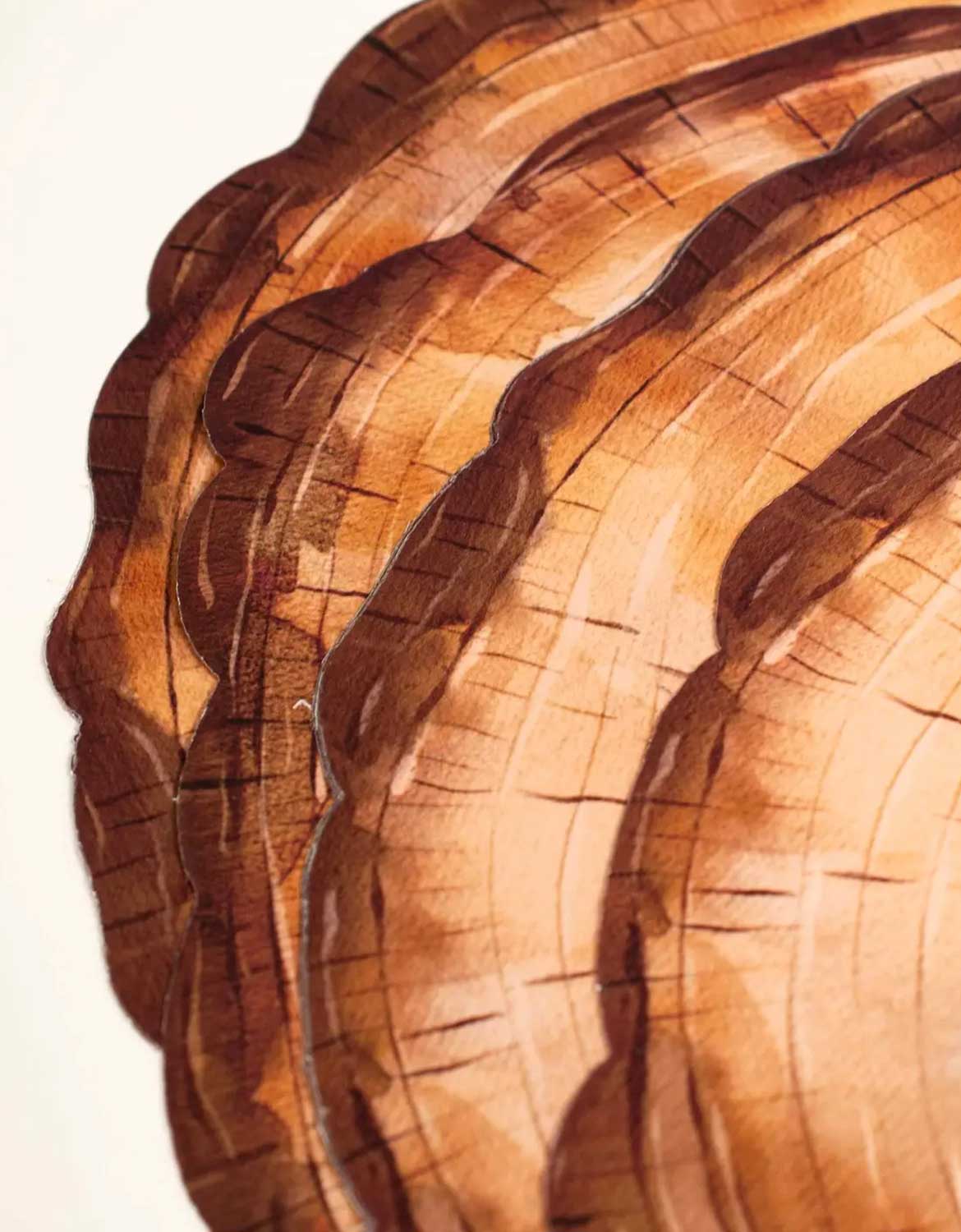 Close-up of Momo Party's wooden slice party placemats stacked with visible grain patterns against a light background.