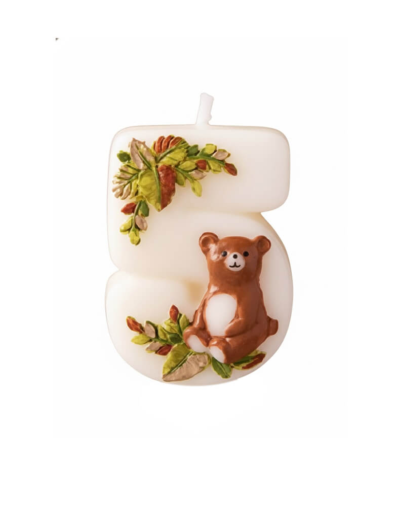 An adorable woodland themed kid's number five birthday candle a cute bear design and some foliage from Momo Party on a white background. Perfect for kid's woodland second birthday party celebration.