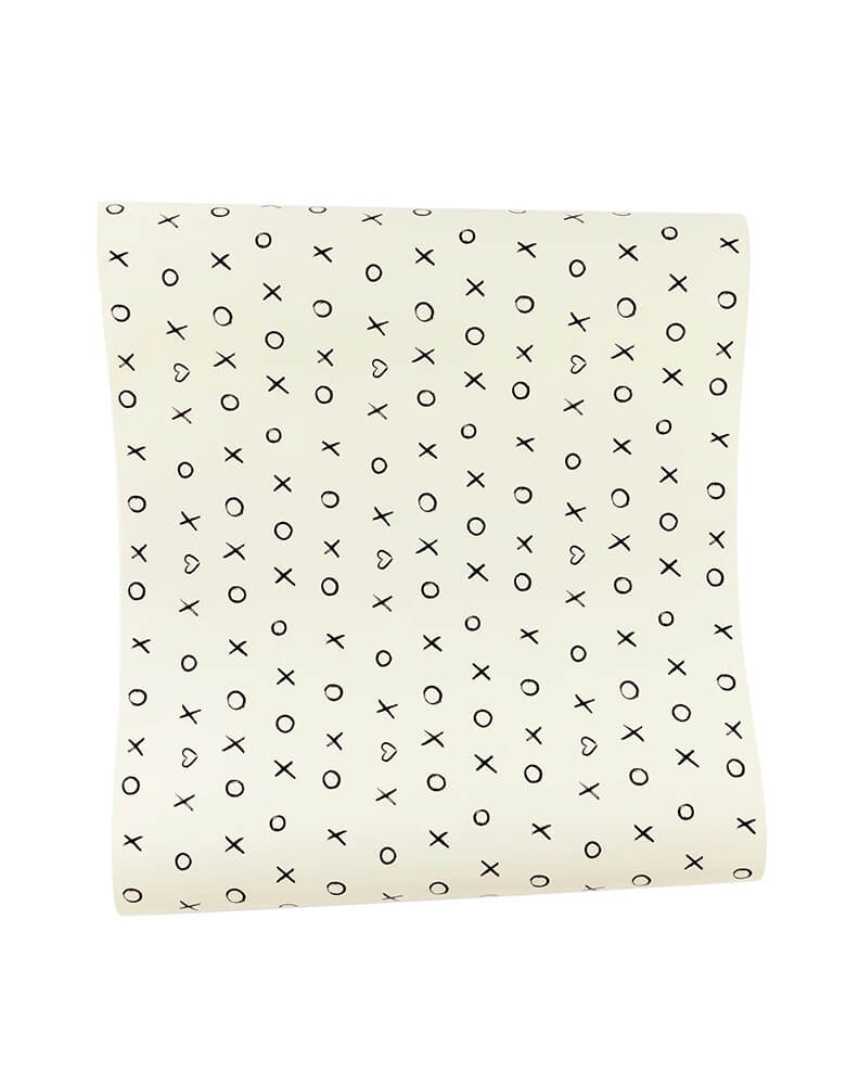 Momo Party's 16" x 120"  black and white XOXO Paper Table Runner by My Mind's Eye. This playful yet sophisticated runner will add a little oomph to your Valentine's Day tablescape, with its sweet black and white xoxo print. 
