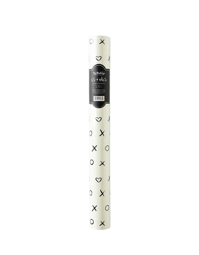 Momo Party's 16" x 120" black and white XOXO Paper Table Runner by My Mind's Eye. This playful yet sophisticated runner will add a little oomph to your Valentine's Day tablescape, with its sweet black and white xoxo print.