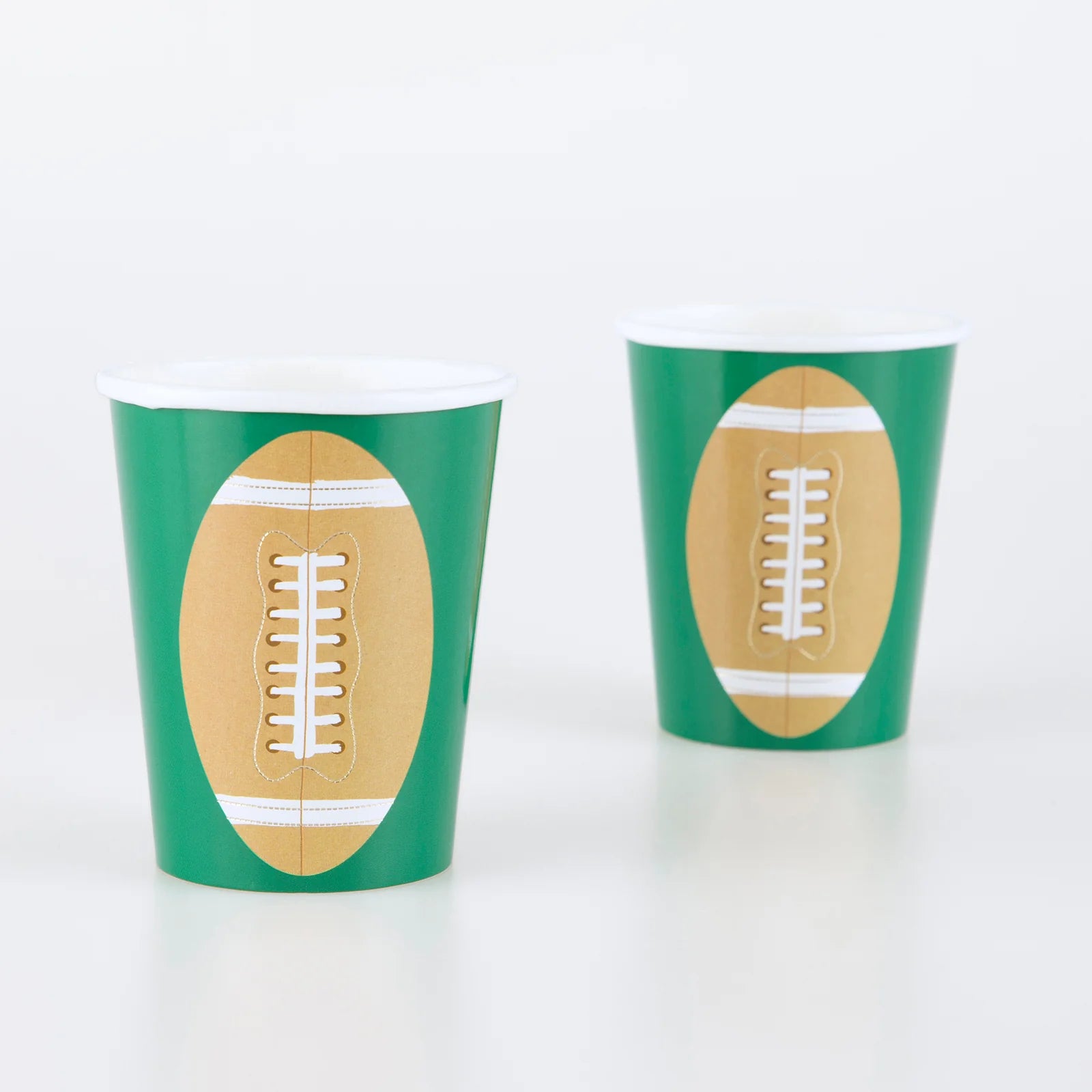 Momo Party's 9oz football cup by Meri Meri, featuring a football illustration on green with gold foil accents, this set of party cups are prefect for kid's football themed  birthday party, a Super Bowl party or a viewing party.