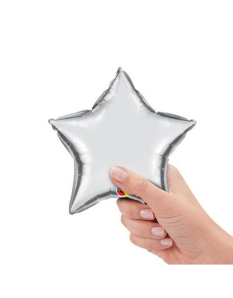Qualatex Balloons - 9″ Mini Star Shaped Foil Balloon in Silver color with hand holding it
