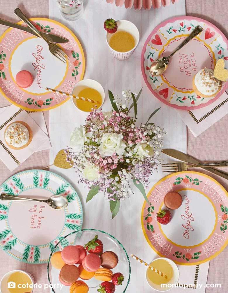 A beautiful table set with Momo Party's 9" "All you need is love" round plates featuring 3 designs with messages including "To the Moon and Back," "Only Yours," "You Have my Heart" on the plates, they are prefect for a love themed celebration or a Valentine's Day party.