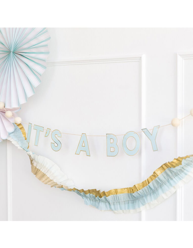 My Mind's Eye Baby Blue Banner hung on the wall in a boy baby shower