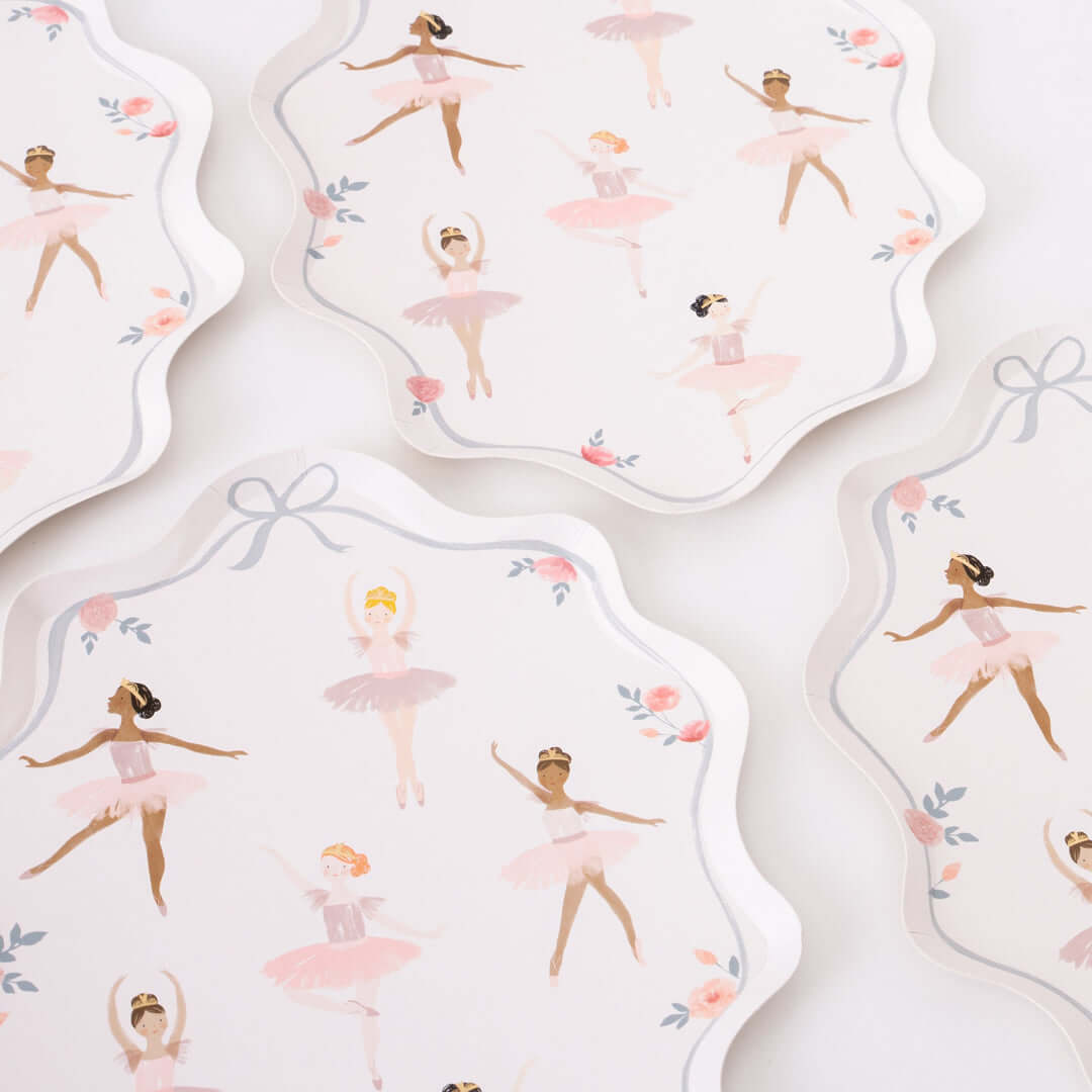 Close up look of Ballerina Plates by Meri Meri on the white table. Featuring beautiful plate with a wonderful curved border, illustrations of dancing ballerinas and flower, ribbon. They will add amazing decor to your Ballerina themed birthday party table, or dance lovers