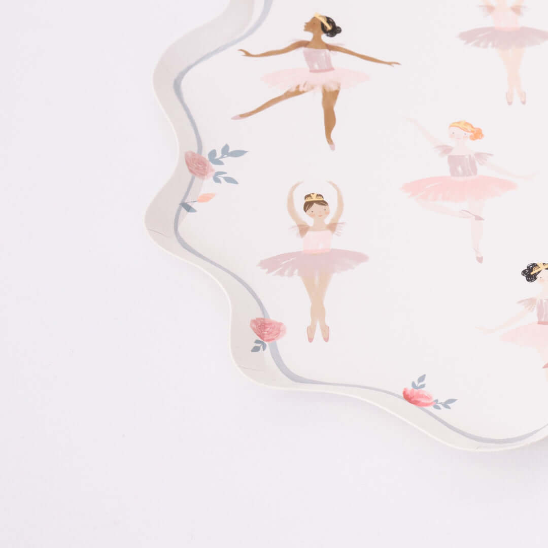 A detail look of Ballerina Plates by Meri Meri. Featuring beautiful plate with a wonderful curved border, illustrations of dancing ballerinas and flower, ribbon. They will add amazing decor to your Ballerina themed birthday party table, or dance lovers