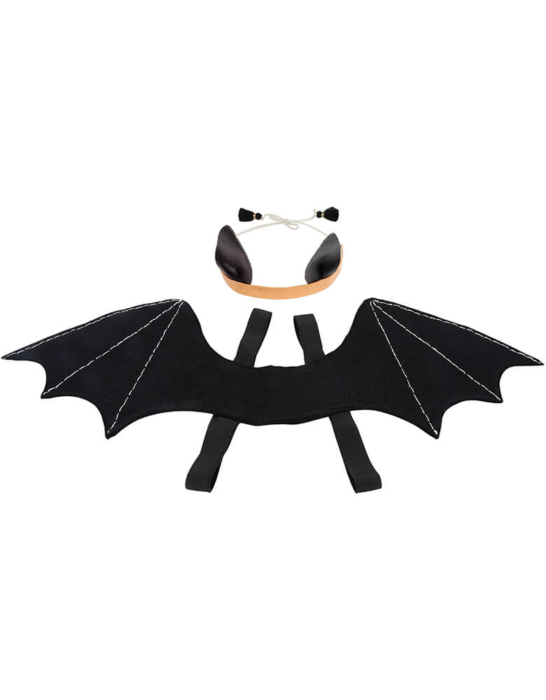 Meri Meri - Bat Wings Costume. This fabulous bat dress-up kit, featuring black felt bat wings and a bat ear headband, is spook-tacular for little ones to glide around in this Halloween. It makes a fabulous gift too, as comes presented in a delightful drawstring bag. The headband has black leatherette ears, a natural leather band and a charming cord tie and tassel details. its Easily put on the wings with the black elastic arm straps