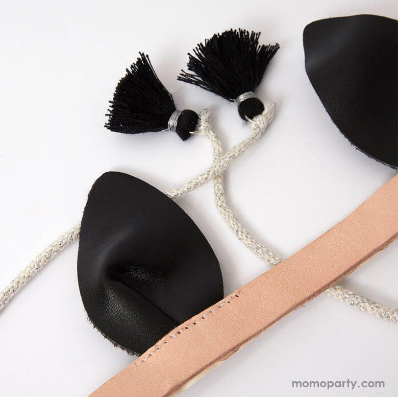 Close up details of Meri Meri - Bat Wings Costume. This fabulous bat dress-up kit, featuring The headband has black leatherette ears, a natural leather band and a charming cord tie and tassel detail, is spook-tacular for little ones to glide around in this Halloween