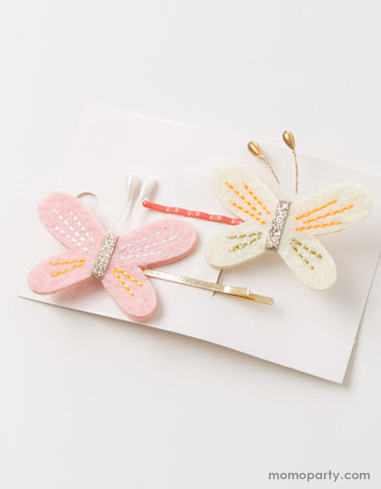 A set of Hair pins featuring Felt butterfly shape in a variety of pastel pink and cream colors with glitter sawing details. Set of 2 for butterfly lover, girl's fairy themed birthday gift, easter basket filler, stocking stuffer idea