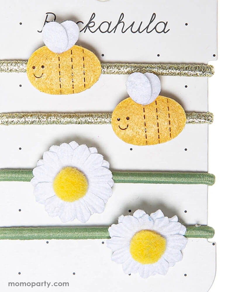 close up details of Rockahula Kids - Bertie Bee And Daisy Hair Ties. set of 4. You cant help but bee happy when wearing this cute set of ponies! The busiest little bumble bees adorn two elastics, whilst daisies with pom pom detail adorn another two elastics. Each bee is delicately detailed with a smiley face, and two dainty little wings to help keep him buzzing around all summer long!