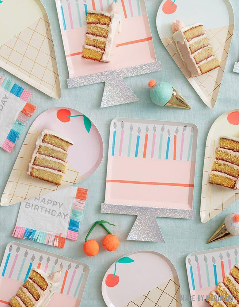A birthday party table with Meri Meri's happy birthday cake plates, napkins and birthday cakes