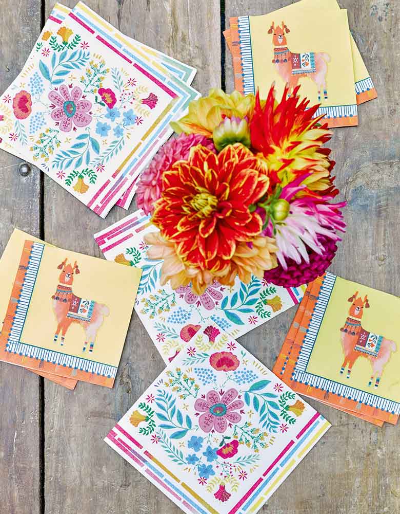 A fiesta themed party table featuring Talking Tables Boho Fiesta Floral Napkins and Llama napkins