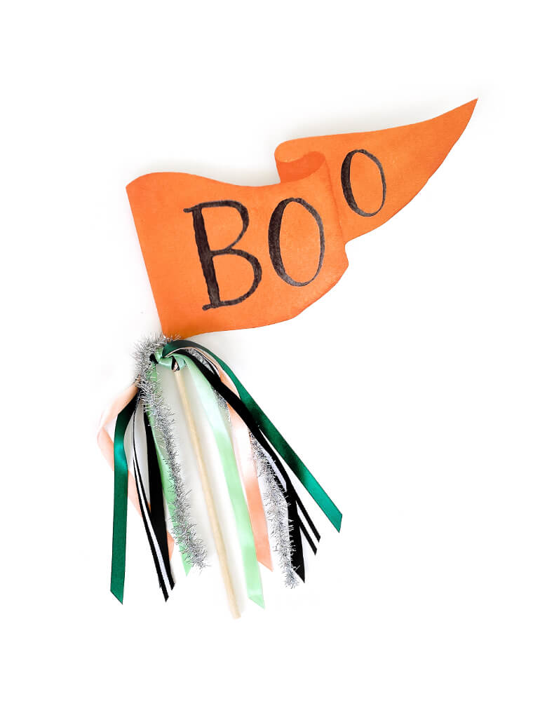 Boo Pennant by Cami Monet. This 10 x 5 inches handmade pennant featuring a handwriting "Boo" Black text with watercolor background in orange, on the 120 lb. luxe watercolor texture paper with original illustration for extra whimsy, and with mutily Ribbon and sparkle garland adding details on the rod. This high quality made party pennant is so cute for celebrating Halloween! Hold it in a photo or pop on a cake or use as your halloween room decoration