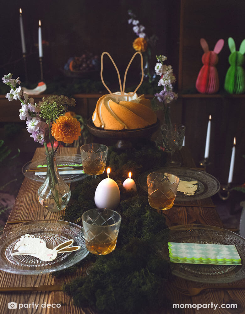 A beautiful rustic Easter table decorated with lots of spring flowers and honeycomb carrot and Easter egg decorations as centerpiece, with Momo Party's 5 x 6.3" bunny napkins by Party Deco, it makes a great inspiration for an adorable kid's Easter tableset.