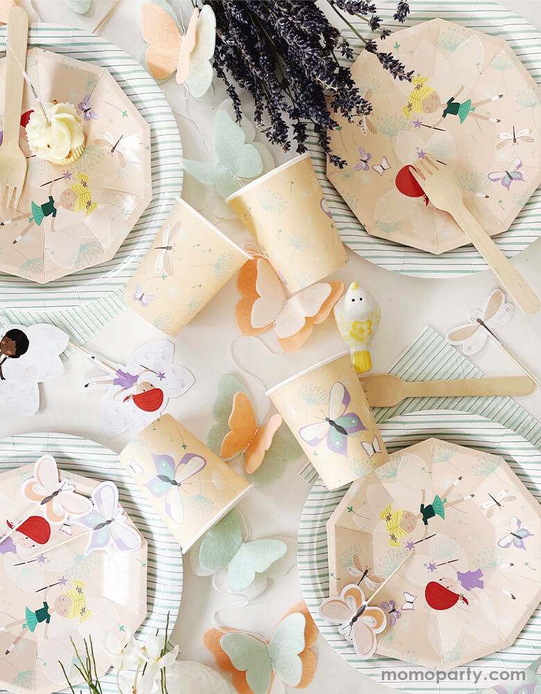Fairy butterfly party set up with handmade Pooka Party Butterfly Felt Garland in the middle of the table, which featuring a felt garland with peach, mint and white butterflies. There are Magical Fairies Small Plates layered with Mint Fine Stripes Plates, and with Magical Fairies Cups around. This Magical Fairies party collection party supplies are perfect for Girl's birthday party, Fairies party, butterfly themed party.
