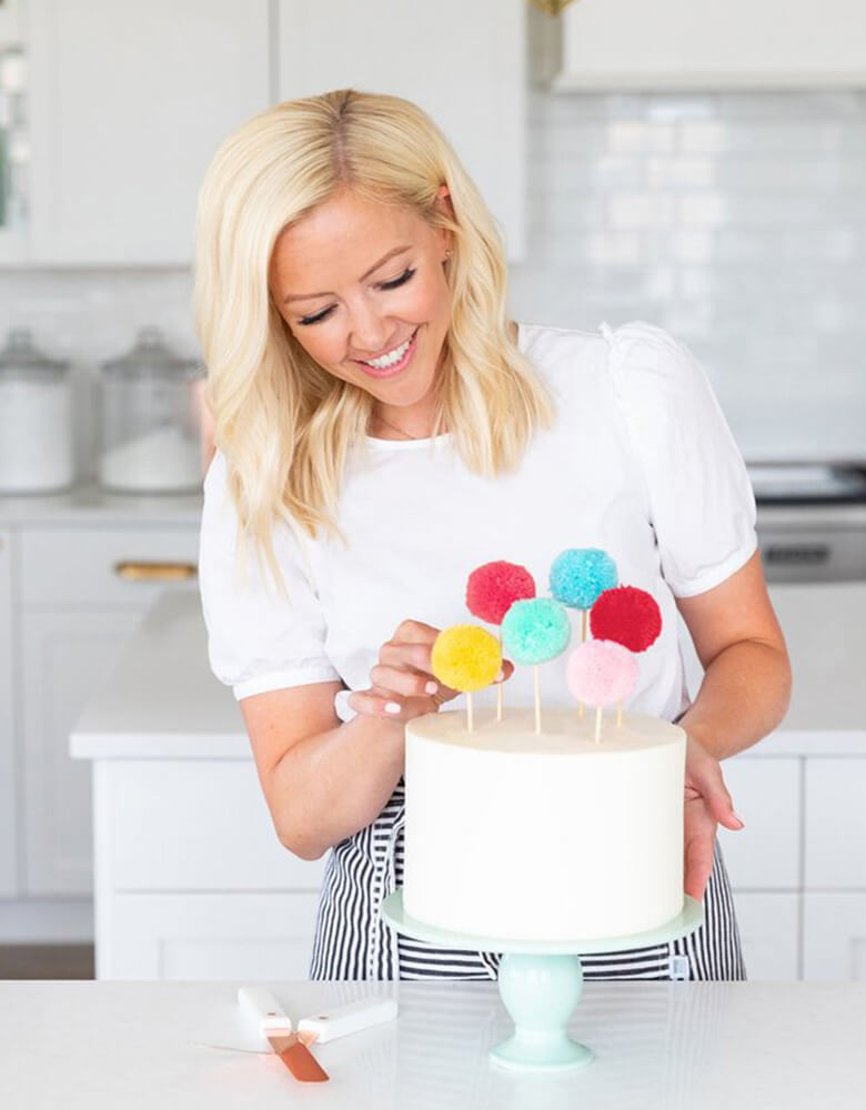 Courtney dresses her cake with the Pom Pom Cake Toppers