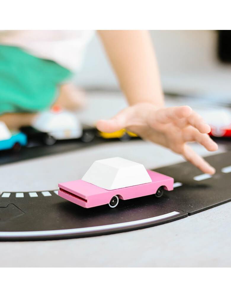 Kid's planning Candylab Candycar Pink Sedan on a toy asphalt road