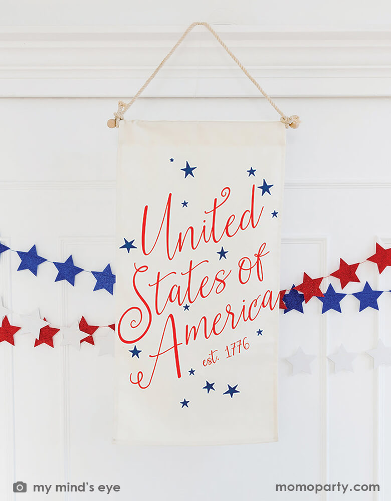4th of july room decoration with My Mind's Eye - Canvas Hanging Door Flag and Stars and Stripes Star Mini Banner on the white wall. These high quality modern party supplies are Perfectly patriotic display this Fourth of July with this door hanging flag!