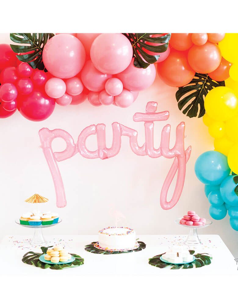 Northstar 44" Clear Pink Party Script Air-filled Balloon decoration for a Tropical themed party with a colorful balloon garland with tropical palm leaves