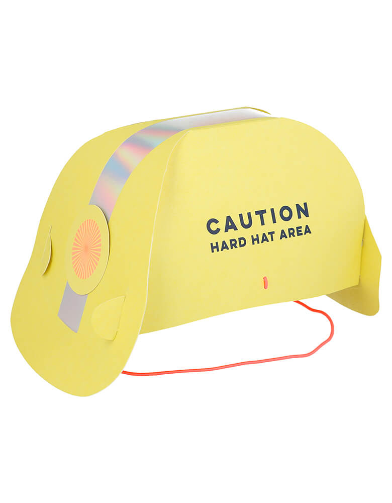 Side view of Meri Meri Construction Party Hats. They are crafted from high quality card and feature the words "Caution. Hard Hat Area" in the side of the hat. They have lots of shiny silver holographic foil for a fabulous effect, They are comfortably kept in place with bright orange elastic