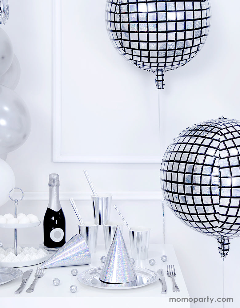 Hip hop disco party with Party Deco sparkly cool disco ball shaped Disco ball foil balloons, champaign bottle, silver iridescent plates, cups and party hats 