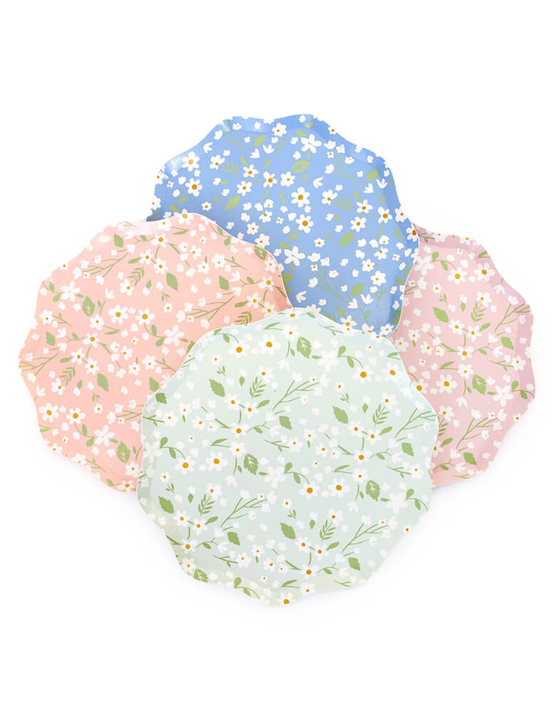 Ditsy Floral Side Plates By Meri Meri. Features a fabulous floral pattern with a stylish scalloped edged paper plates.  Pack of 12 in 4 colors: blue, green, pink and peach. Made from eco-friendly paper.  Add a touch of springtime beauty to your party table with these high quality, well designed party plates.