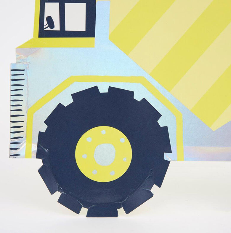 close up details of Meri Meri Dump Truck Plates. These fabulous dump truck die cut shaped plates are beautifully crafted with lots of shimmering foil, and will look amazing on the party table, for a construction themed party, dig in themed party, boy's birthday party, Your little truck-loving ones will be absolutely over the moon with these shiny dump truck plates.