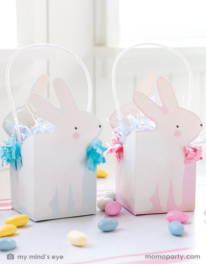 Easter Party Table with Momo Party's 3" X 3" X 7" bunny treat boxes by My Mind's Eye. Come in a set of 8 mini baskets in two colors of pink and aqua, featuring fringe edges, they also make wonderful mini baskets for your kids this Easter.