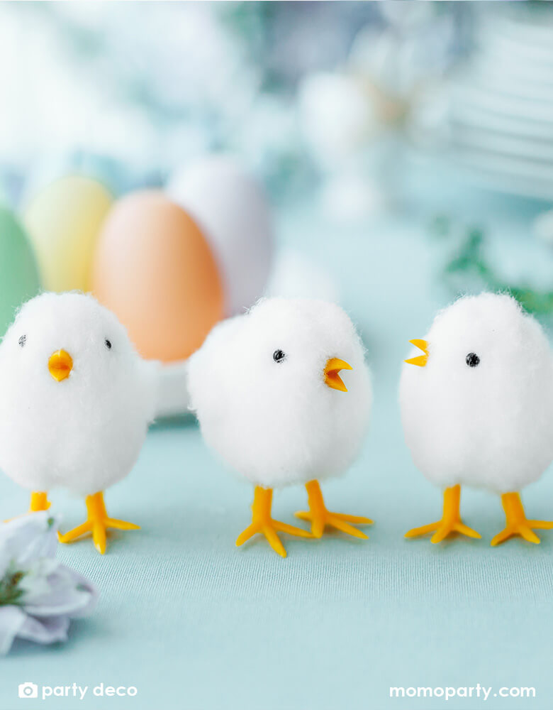 Momo Party's 2.75" Easter Chicks Decorations by Party Deco, set of 9 on a Easter party table with egg shaped candles and spring floral arrangement.