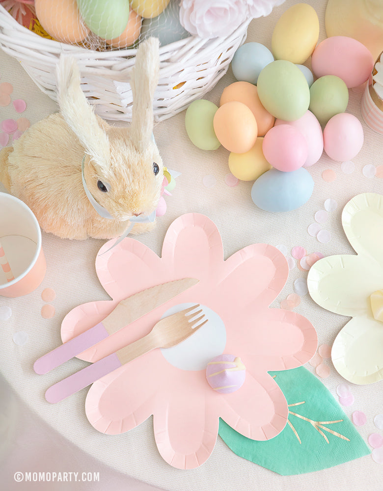 Modern pastel Easter Party celebration idea of Pastel Daisy Large Plates, Pastel Cups, Leaf Napkins and Easter Basket and pastel eggs on the kid's table