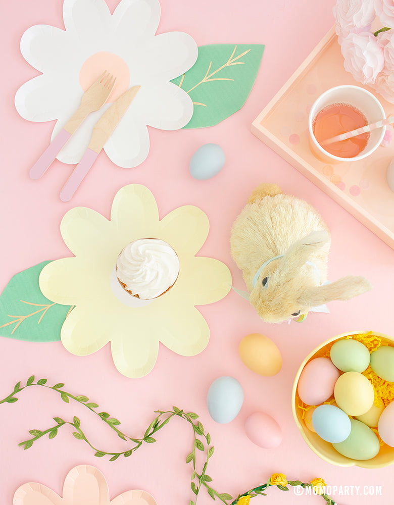 Modern pastel Easter Party celebration idea of Pastel Daisy Large Plates, Pastel Cups, Leaf Napkins and Easter Basket and pastel eggs on the kid's table