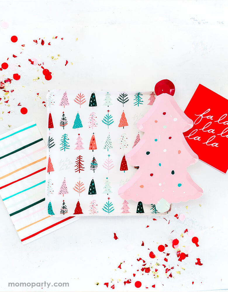 A pink Christmas table filled with My Minds Eye Fa La La Pink Christmas Collection of Fa La La Pink Frosting Christmas Tree Plate, Fa La La Christmas Trees Plates, and Fa La La Christmas dinner napkin in cheery pastel colors by Oui Party