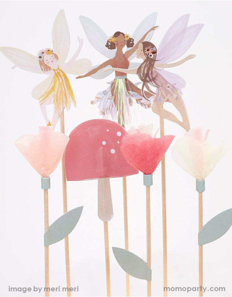 Close up details of  Meri Meri Fairy Cake Topper. Featuring 3 fairies, a toadstool and flowers topper